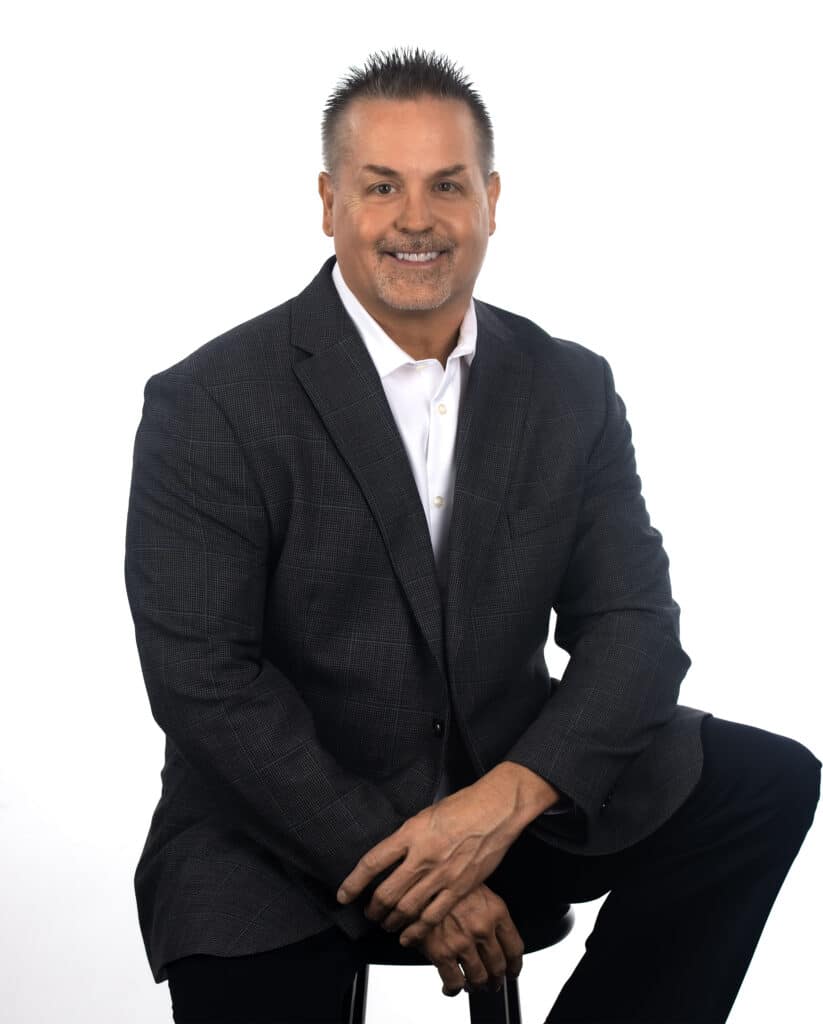 Chad Chaney - sitting on chair headshot